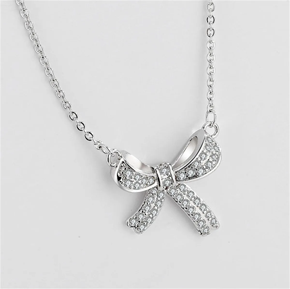 Cubic Zirconia & Silver-Plated Bow Pendant Necklace