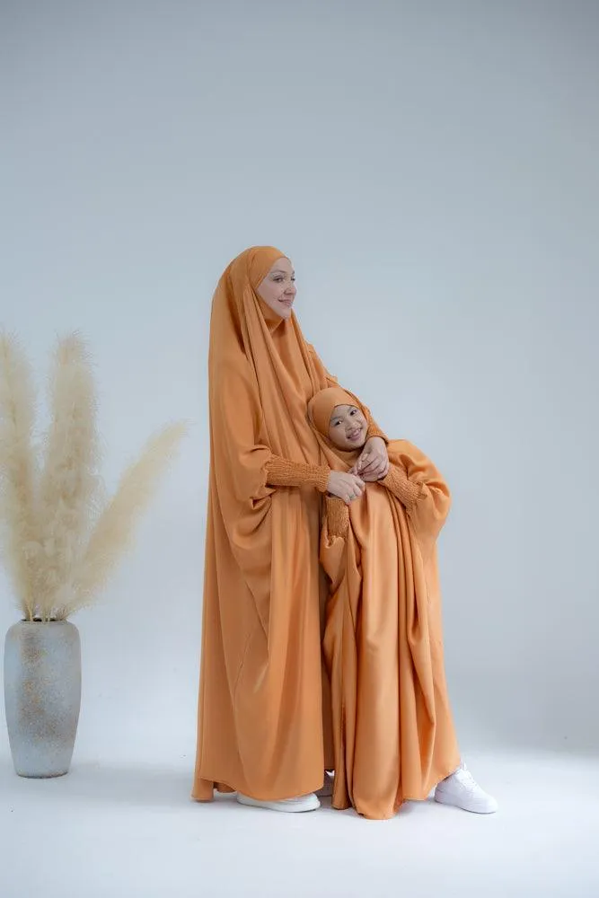 Little Gretaah prayer gown for kids in khimar style with ribbed sleeve cuff in  Orange