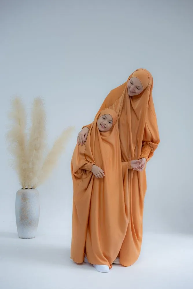 Little Gretaah prayer gown for kids in khimar style with ribbed sleeve cuff in  Orange
