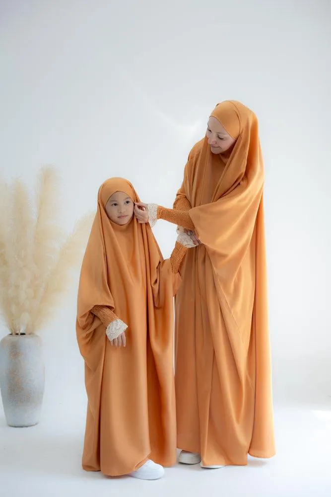 Little Gretaah prayer gown for kids in khimar style with ribbed sleeve cuff in  Orange