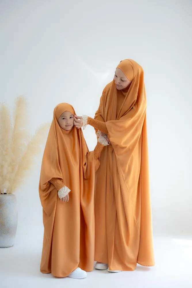 Little Gretaah prayer gown for kids in khimar style with ribbed sleeve cuff in  Orange