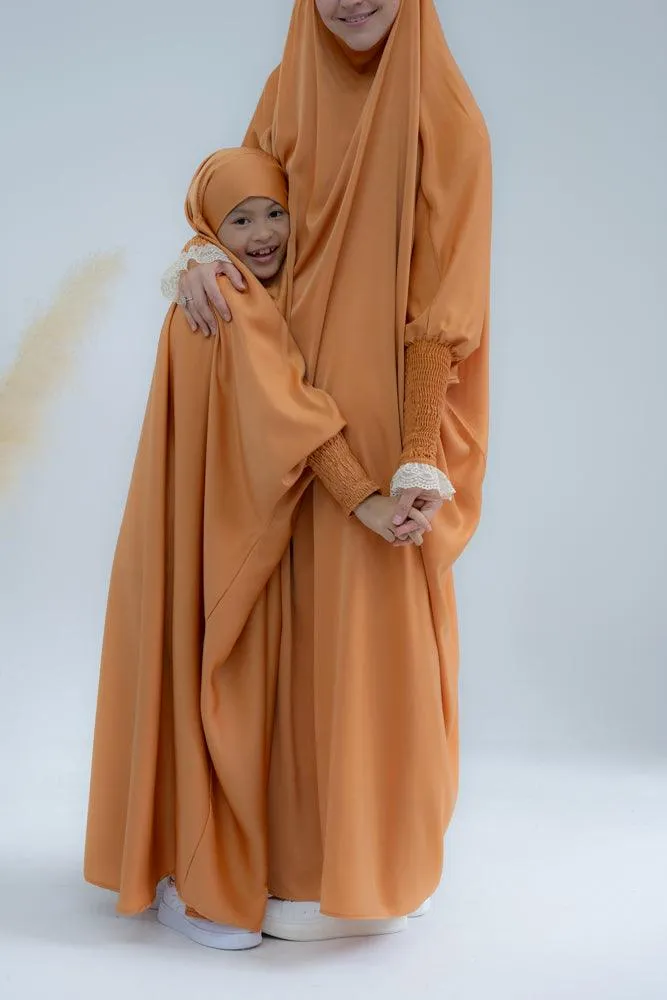 Little Gretaah prayer gown for kids in khimar style with ribbed sleeve cuff in  Orange