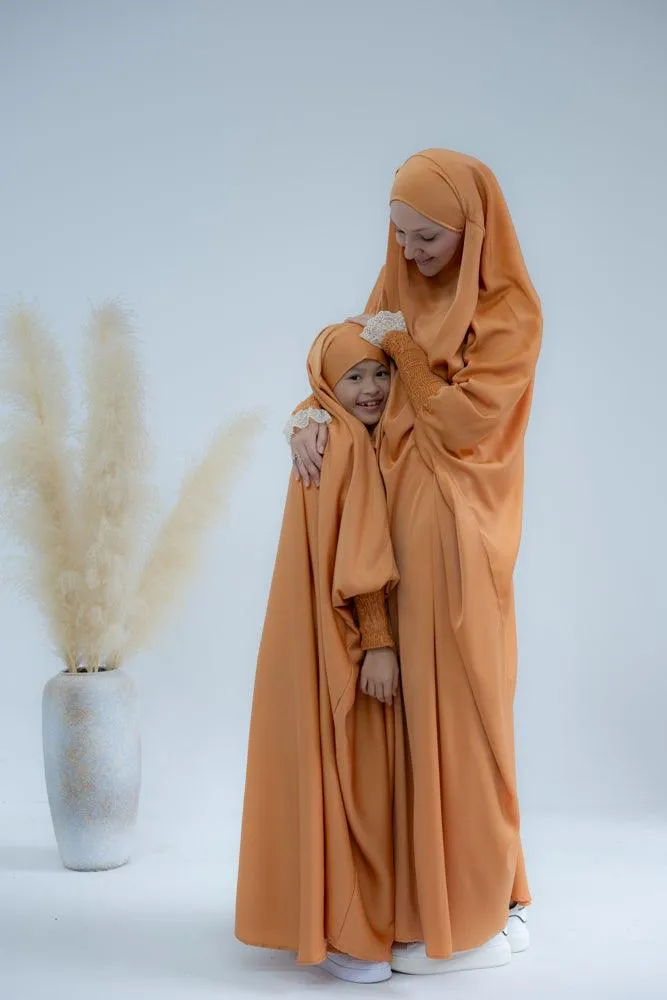 Little Gretaah prayer gown for kids in khimar style with ribbed sleeve cuff in  Orange
