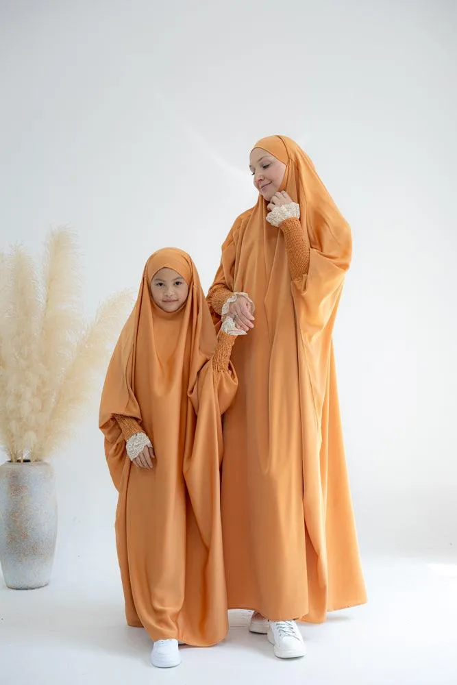 Little Gretaah prayer gown for kids in khimar style with ribbed sleeve cuff in  Orange