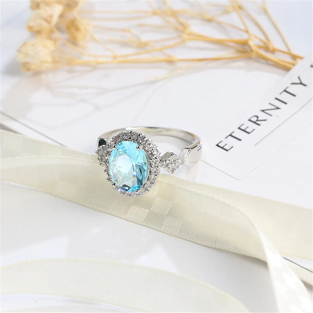Sea Blue Cubic Zirconia & Crystal Halo Oval Ring